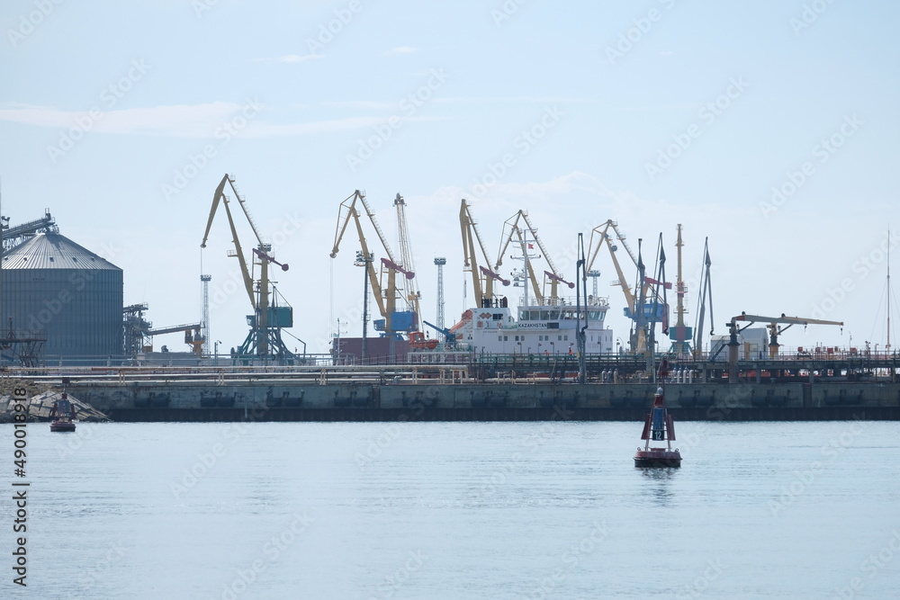 Aktau / Kazakhstan - 08.16.2018 : Lifting machines unload and load ships