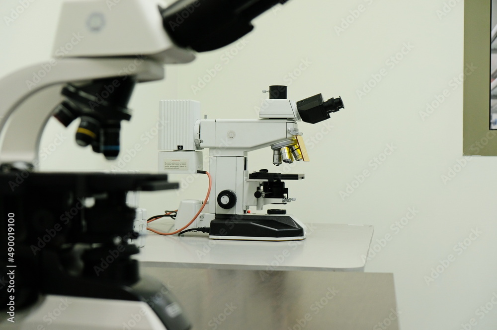 Almaty / Kazakhstan - 05.23.2018 : The microscope is in an empty laboratory Almaty / Kazakhstan - 05.23.2018 : The microscope is in an empty laboratory