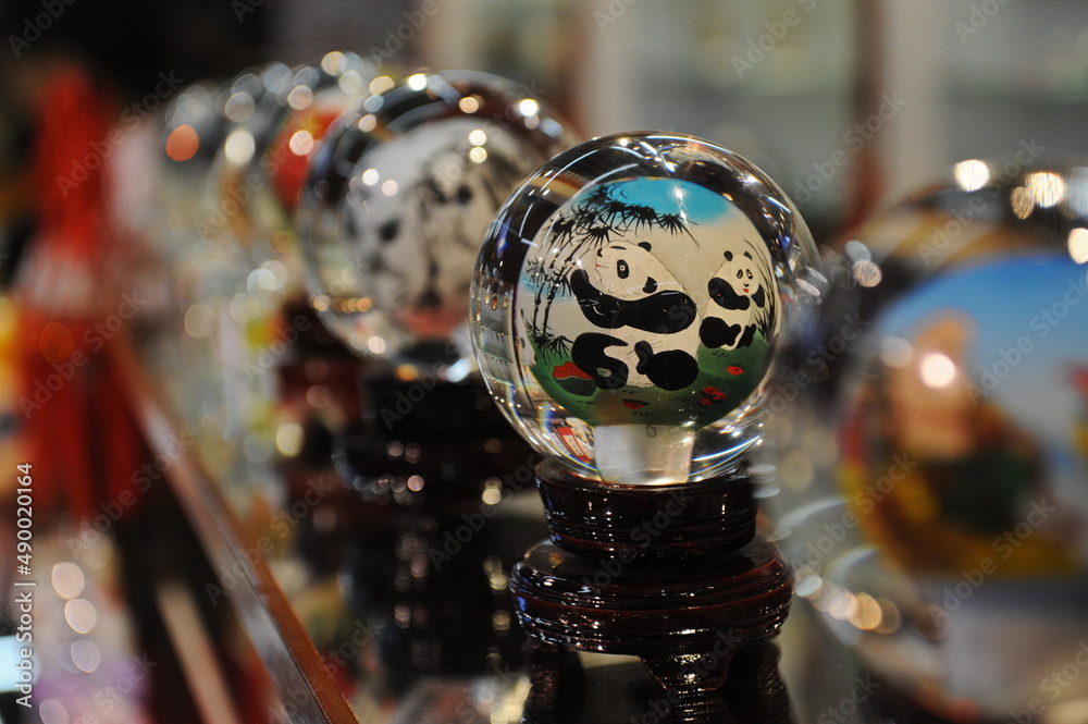 Beijing / China - 08.05.2012 : A ball with a Panda in a Chinese style. Shop for carvings made of stone, jade and glass.