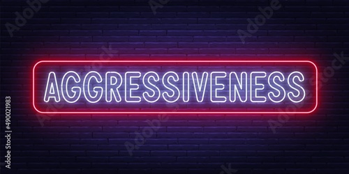 Neon sign Aggressiveness on brick wall background.