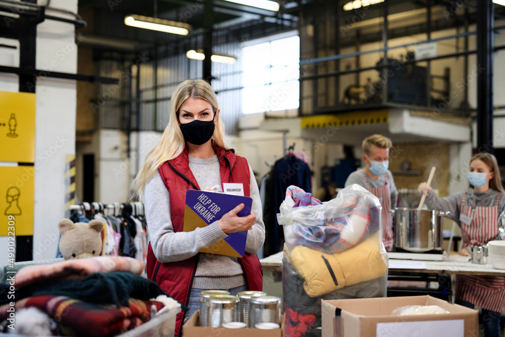 Volunteers collecting donations for the needs of Ukrainian migrants, humanitarian aid concept. Volunteers collecting donations for the needs of Ukrainian migrants, humanitarian aid concept.