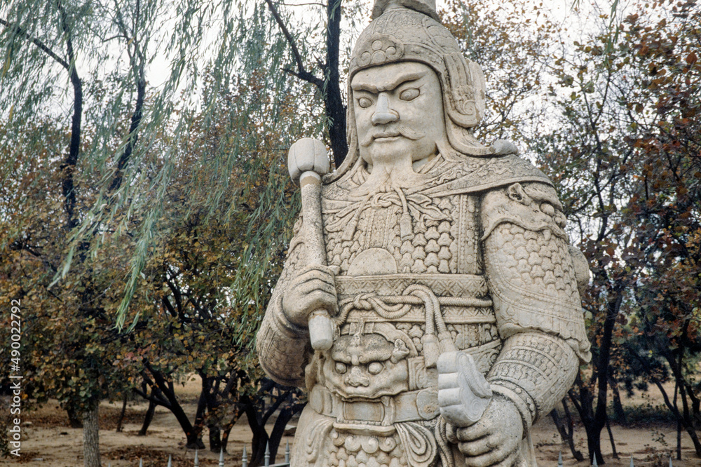 Ornate stone-carved Chinese warrior statues in a park near the Ming Tombs, northwest of Beijing, China. Warrior 