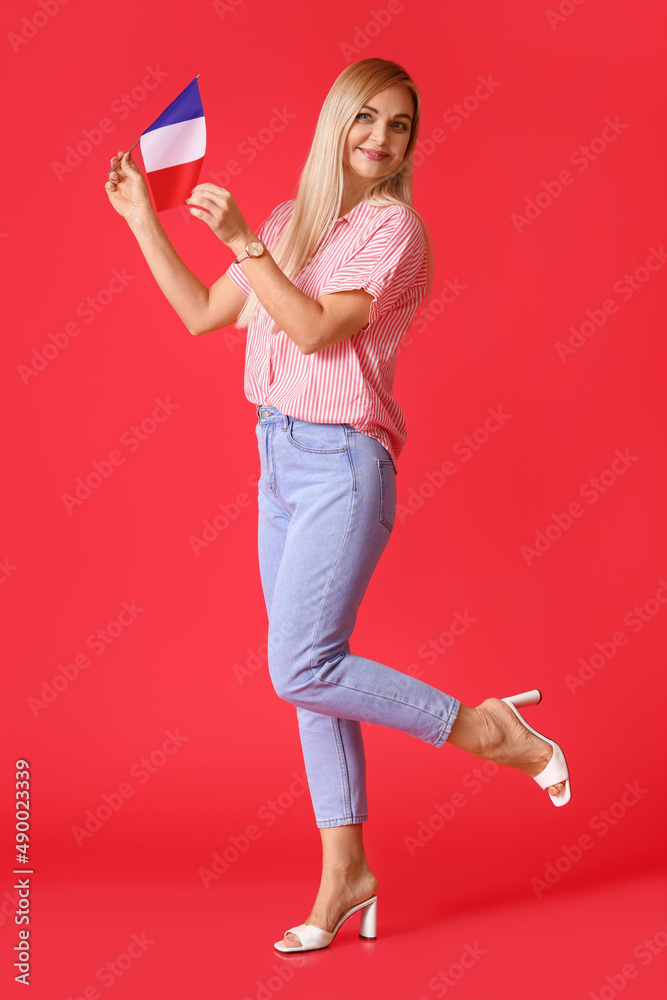 Beautiful woman with flag of France on red background Beautiful woman with flag of France on red background