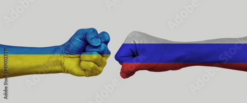 Obraz na plátne Russian vs Ukrainian flag national painted on fist