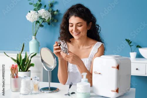 Beautiful woman holding per...