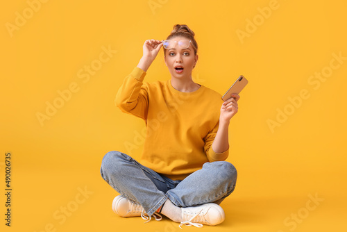 Surprised young woman with ...