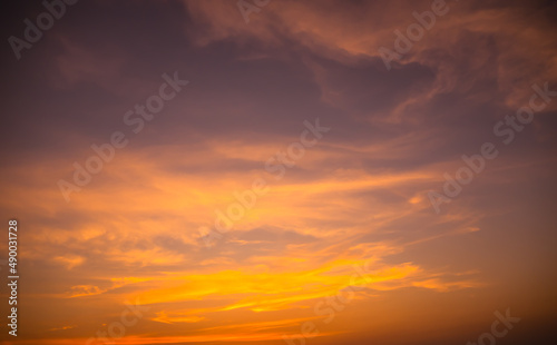 Evening Sky, twilight dramatic gold sunset dusk background. colorful sunlight cloud sky pastel bright yellow orange backdrop. nature landscape beautiful. © wing-wing