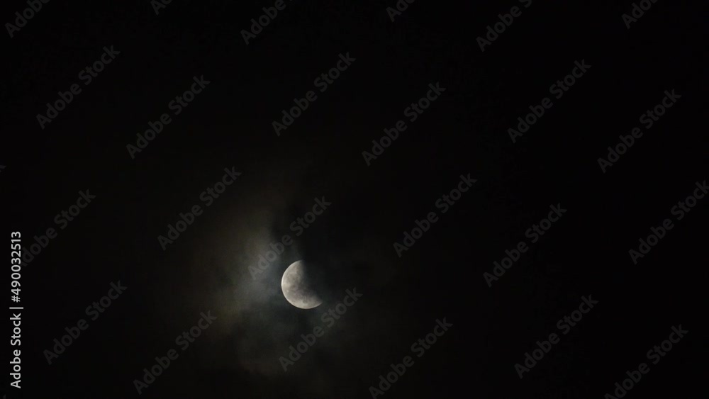 NAHA, OKINAWA, JAPAN - 26 MAY 2021 : Total eclipse of super blood moon seen in northern Japan and Okinawa. A total lunar eclipse during which the full moon hides in the Earth's shadow. Time lapse shot NAHA, OKINAWA, JAPAN - 26 MAY 2021 : Total eclipse of super blood moon seen in northern Japan and Okinawa. A total lunar eclipse during which the full moon hides in the Earth's shadow. Time lapse shot