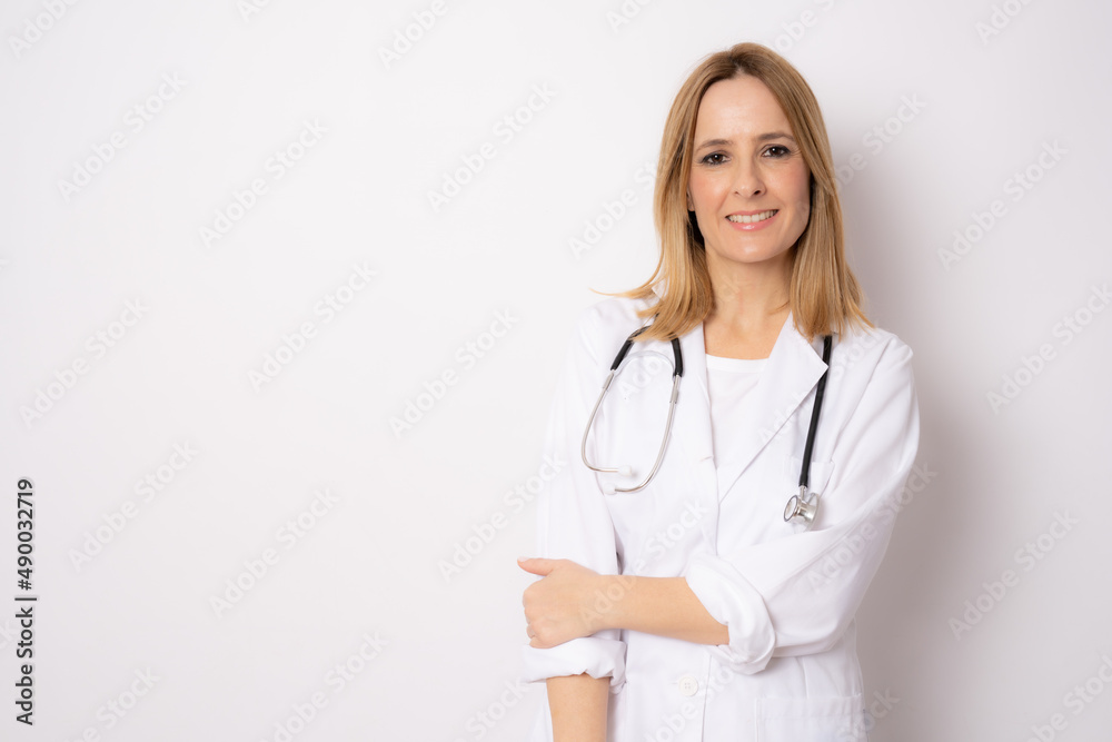 Young doctor woman over isolated background smiling isolated over white background. Medical concept. Young doctor woman over isolated background smiling isolated over white background. Medical concept.