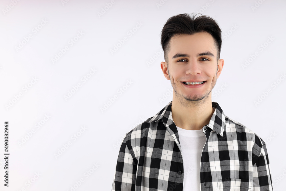 Attractive guy in shirt on white background