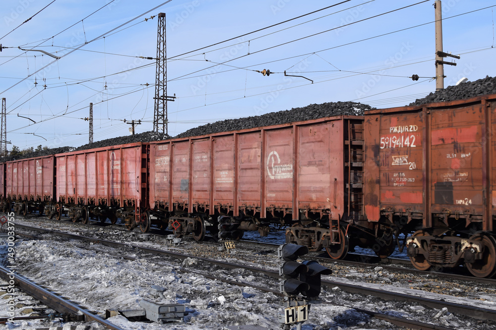 Russian railway train with coal. Russian Railways. Energy crisis concept. Russian railway train with coal. Russian Railways. Energy crisis concept.