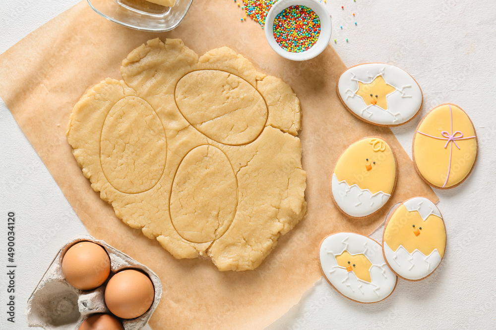 Fresh dough and Easter cookies on light background Fresh dough and Easter cookies on light background