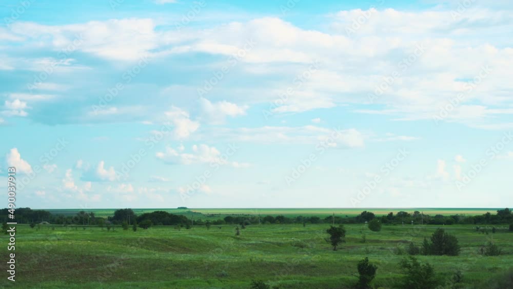 Hello spring. Rural landscape. Green meadow and forest belt in central Russia. Beautiful nature in summer time. Hello spring. Rural landscape. Green meadow and forest belt in central Russia. Beautiful nature in summer time.