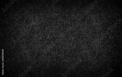 Dark gray color background textured with vignette. 