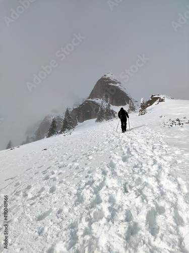 Winter in the mountains. Hiking during wintertime. Snow storm in the high mountains
