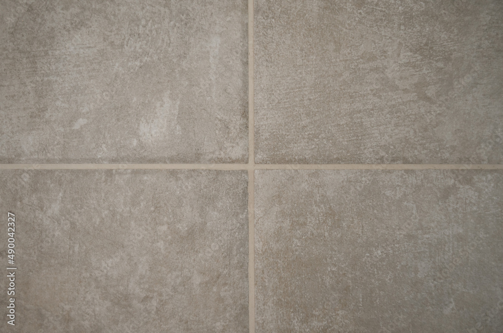 Fototapeta premium Tile seam close-up, gray tile