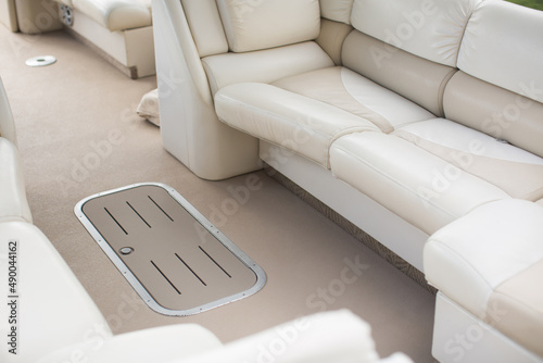 Leather white and beige seats on a luxury yacht © Artem Zakharov