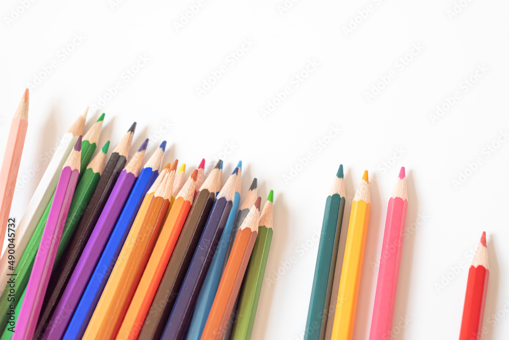 Crayons on a white background. education concept. The concept of kindergarten during the pandemic. The concept of pedagogy. Crayons on a white background. education concept. The concept of kindergarten during the pandemic. The concept of pedagogy.