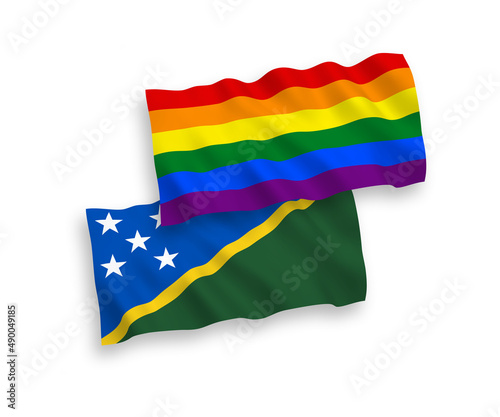 National vector fabric wave flags of Solomon Islands and Rainbow gay pride isolated on white background. 1 to 2 proportion.