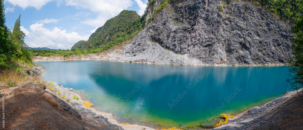 Panorama Amazing pond or lake in tropical rainforest with mountain rocks peak Beautiful water surface in Phang Nga Thailand