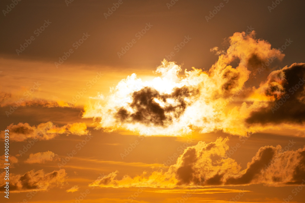Naklejka premium Dark clouds at sunset or sunrise Dramatic thunderstorm landscape with building clouds Natural rainy dark sky Amazing for nature composition background
