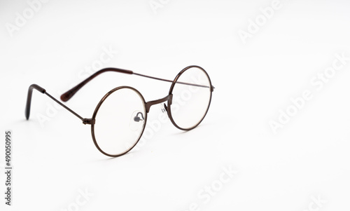 Transparent optical glasses on an isolated white background.