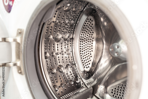 Drum of washing machine dry and clean close-up. Washing Dryer Machine inside view of a drum. © Анатолий Савицкий