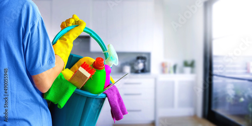 Cleaning lady with set of cleaning supplies on blurred background. in bathroom or toilet. Woman.