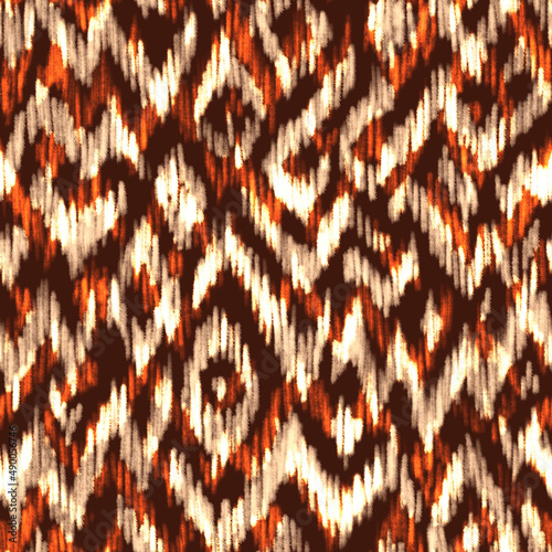 Abstract seamless pattern in earth tones. Spring Summer 2023 fashion trend print for fabric. Block print, batik, earthy inks, wax prints, brush strokes imitation.