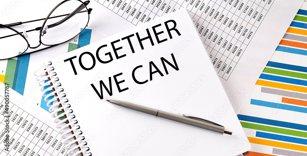 Notebook with text TOGETHER WE CAN . Diagram and white background,Business