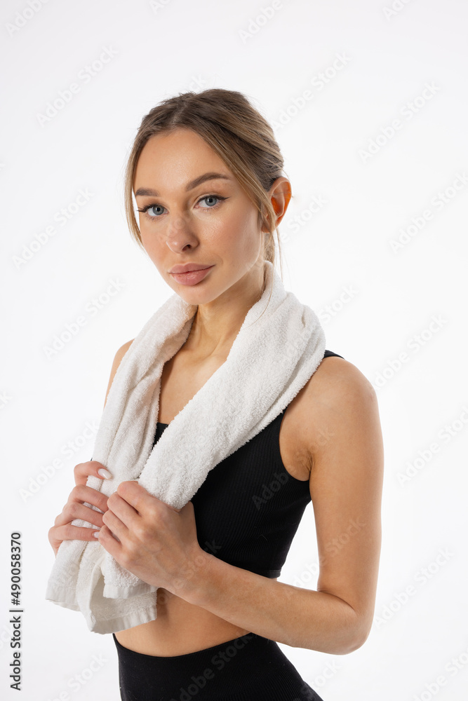 portrait of an attractive female in sportswear with a towel portrait of an attractive female in sportswear with a towel