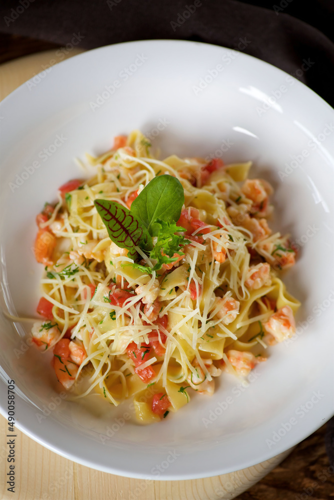 Pasta with cheese and seafood. Italian cuisine.