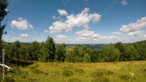 A timelapse at the clouds passing by near Marisel village in Apuseni Mountains. photo