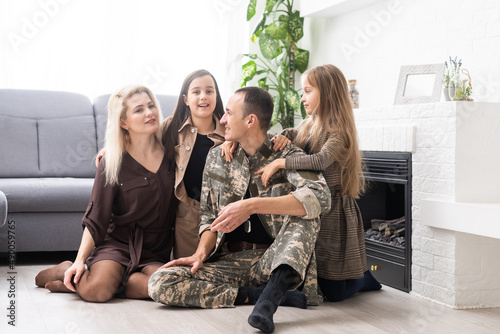 Military father with his family at home