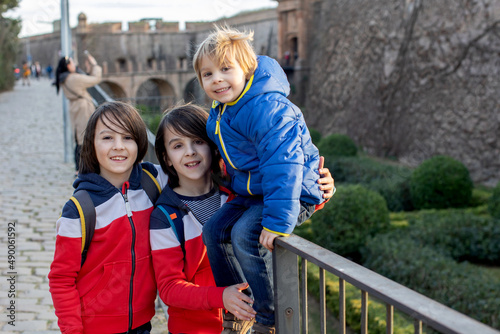 Cute little children tourists admiring Barcelona city, family travel with kids © Tomsickova