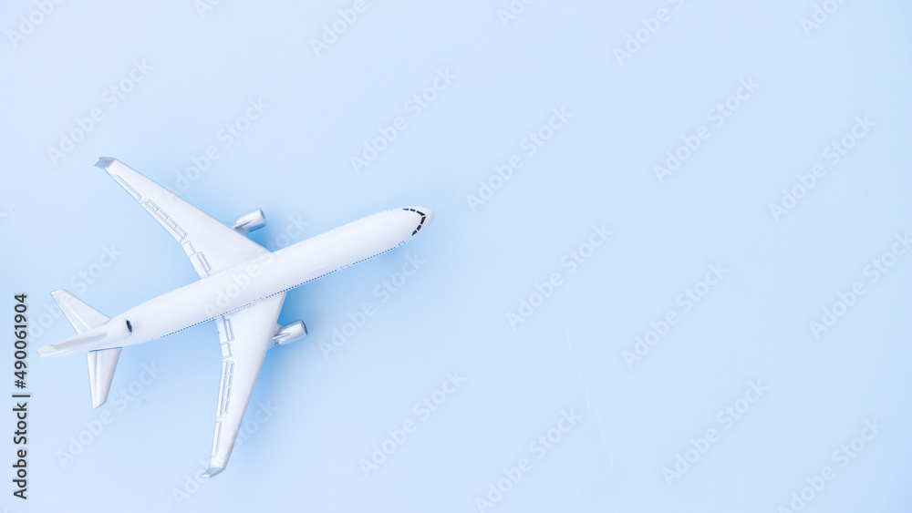 White airplane model on a blue background White airplane model on a blue background