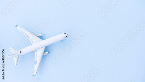 White airplane model on a blue background