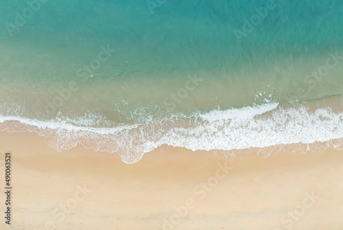 Aerial view of Sunny tropical Caribbean beach with wave of water and sand beach Background
