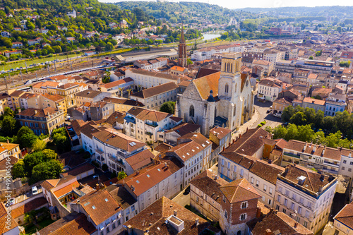 View from drone of reddish roofs of residential buildings of French city of Agen on summer day..