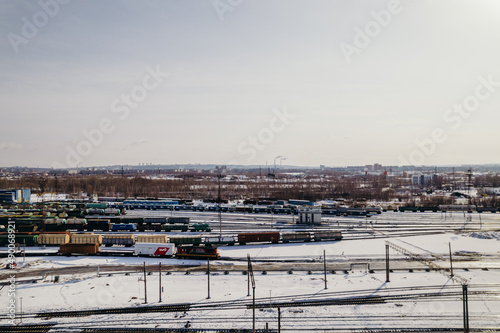 freight train cars on the railway track top view and view of the city and rails