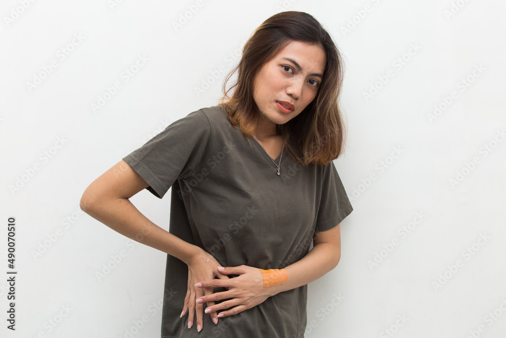 Young asian woman suffering low back pain and waist lumbar pain
Young asian woman suffering low back pain and waist lumbar pain