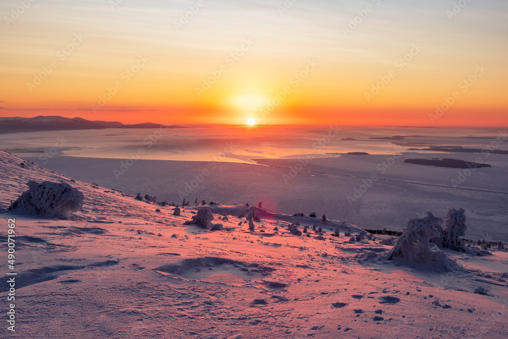 Beautiful Arctic sunset. Panoramic scenic colorful sky at dawn. Aerial view. Sunrise bright sky with White Sea. Top View from high altitude.