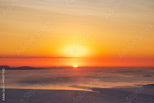 Beginning of sunrise. Colorful sky background concept. Dramatic sunset with twilight colors. Beautiful Arctic sunset. Scenic colorful sky at dawn. Aerial view.