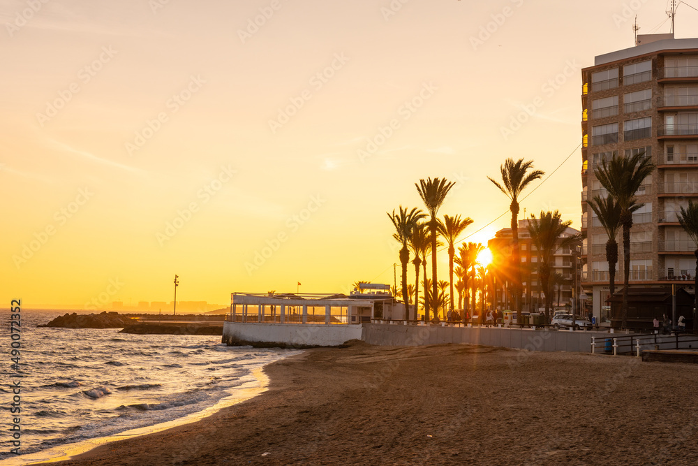 Beautiful sunset at Playa del Cura in the coastal city of Torrevieja, Alicante, Valencian Community. Spain, Mediterranean Sea on the Costa Blanca