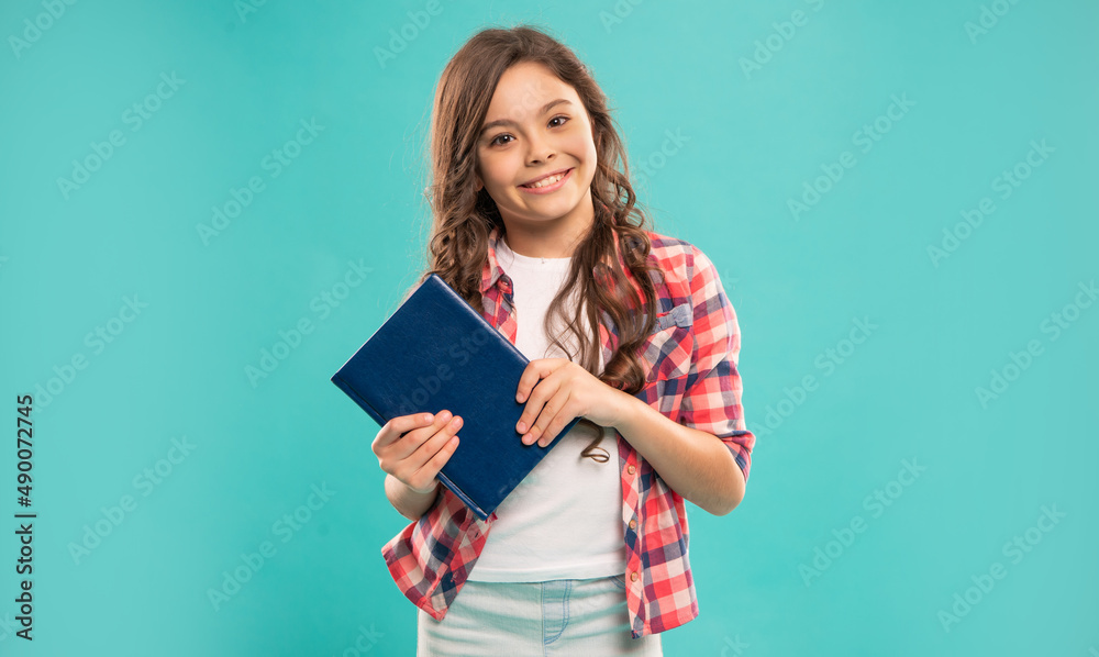 happy kid hold notebook on blue background, education happy kid hold notebook on blue background, education
