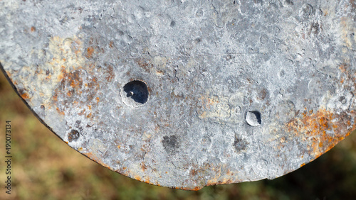 Tableau sur toile Bullet marks on the steel formed spots and holes deepened.