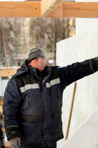Portrait of an installer at the construction of an ice town