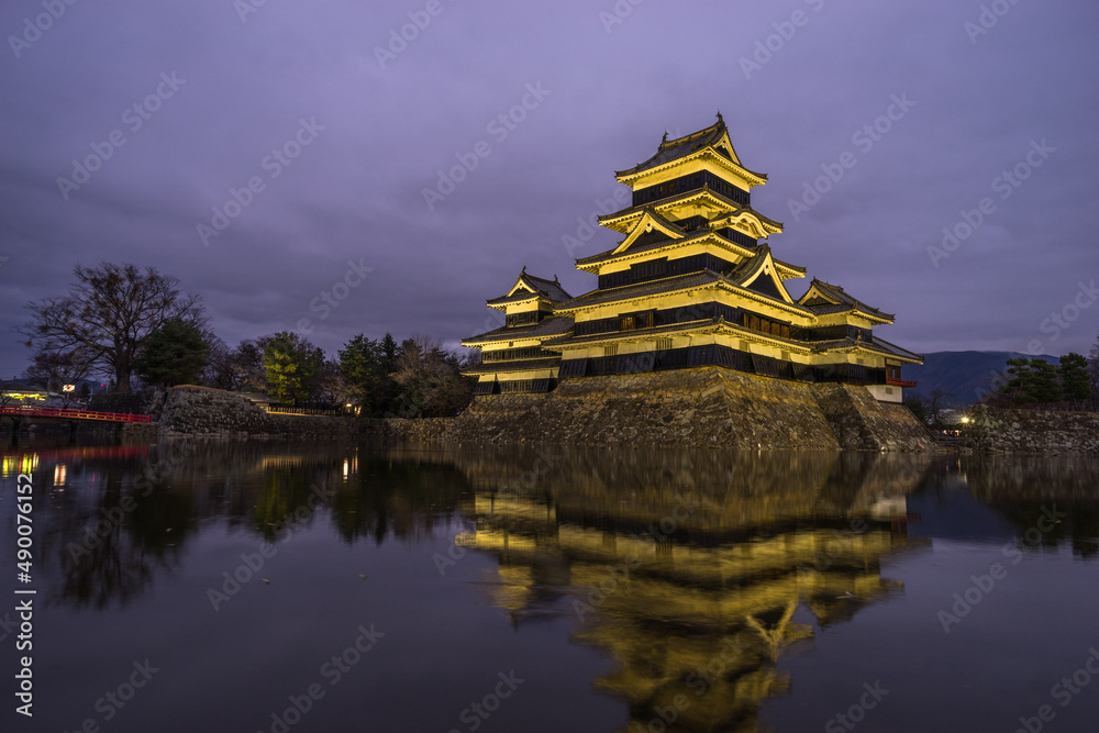 Beautiful lightup scenic of Matsumoto castle in sunset time. Beautiful lightup scenic of Matsumoto castle in sunset time.
