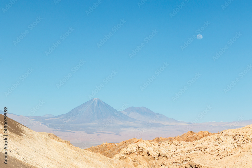 Valle de la Luna in Atacama desert withe Licancabour volcano in the background, Antofagasta, Chile, South America Valle de la Luna in Atacama desert withe Licancabour volcano in the background, Antofagasta, Chile, South America