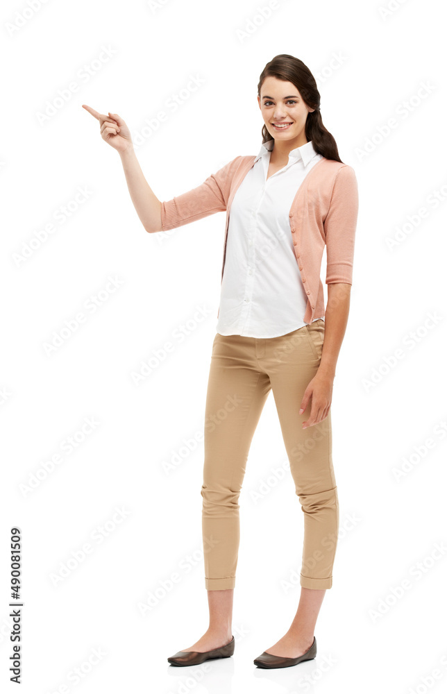 The perfect ad placement. Full length portrait of an attractive young woman pointing towards your copyspace. The perfect ad placement. Full length portrait of an attractive young woman pointing towards your copyspace.